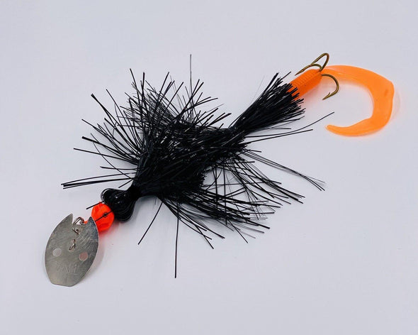 Black Flame The newly designed Angry Dragon from TnA Tackle is here This hybrid bucktail/jig/jerkbait has a newly designed heavy duty blade that not only creates intense vibration, but also "clacks" on the side of the head as well. 