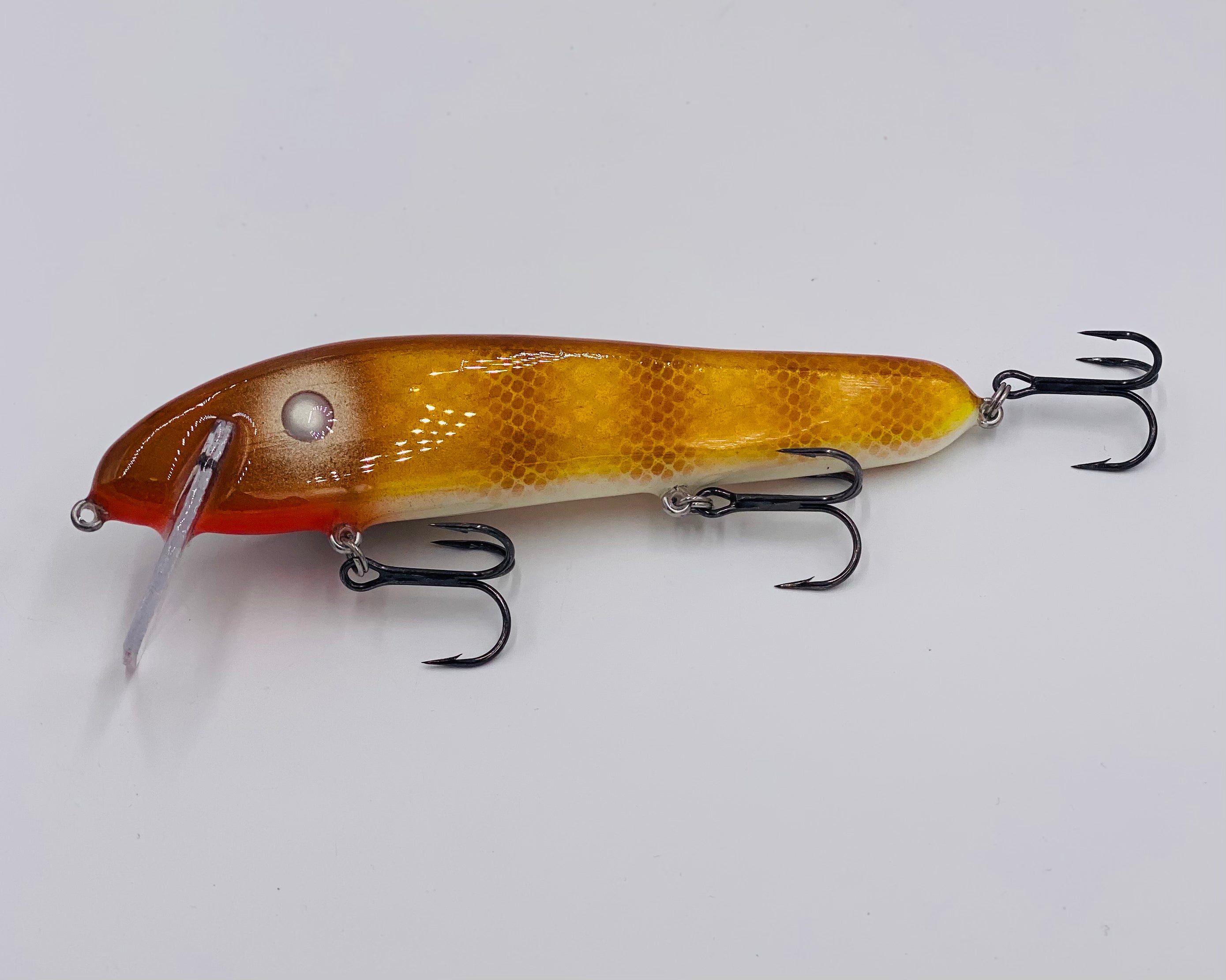 0ld orange color split wood fishing lure with treble hook Big Guy Baits